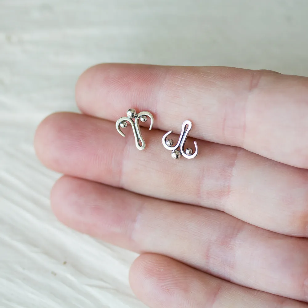 Unusual stud earrings, abstract silver ornament