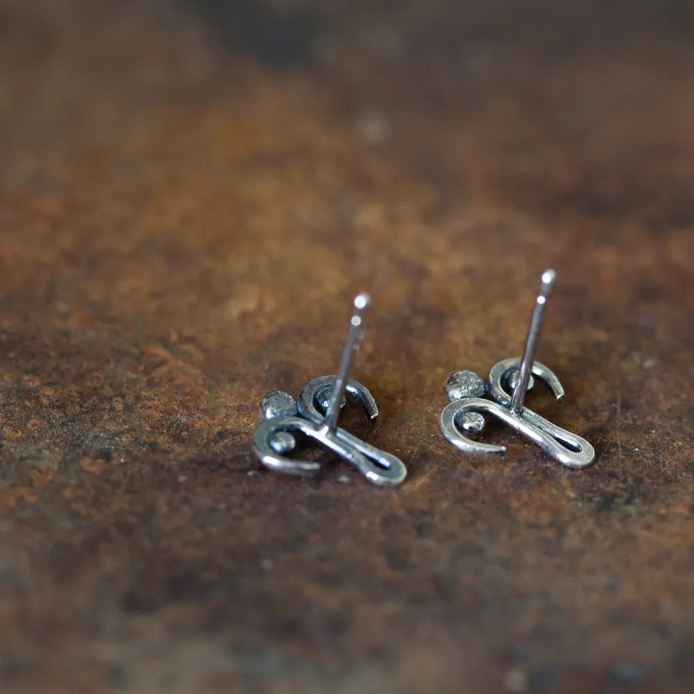 Unusual stud earrings, abstract silver ornament